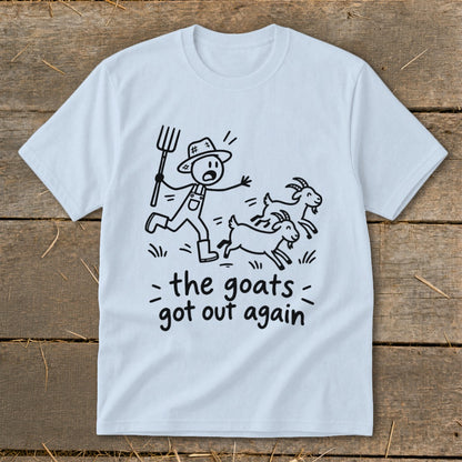 Light blue t-shirt with a cartoon farmer chasing goats, text "the goats got out again".