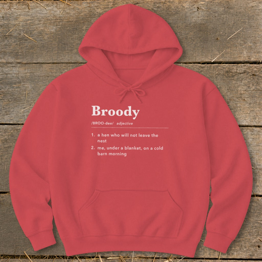 Red hoodie with "Broody" definition: a hen who won't leave the nest, or being under a blanket.