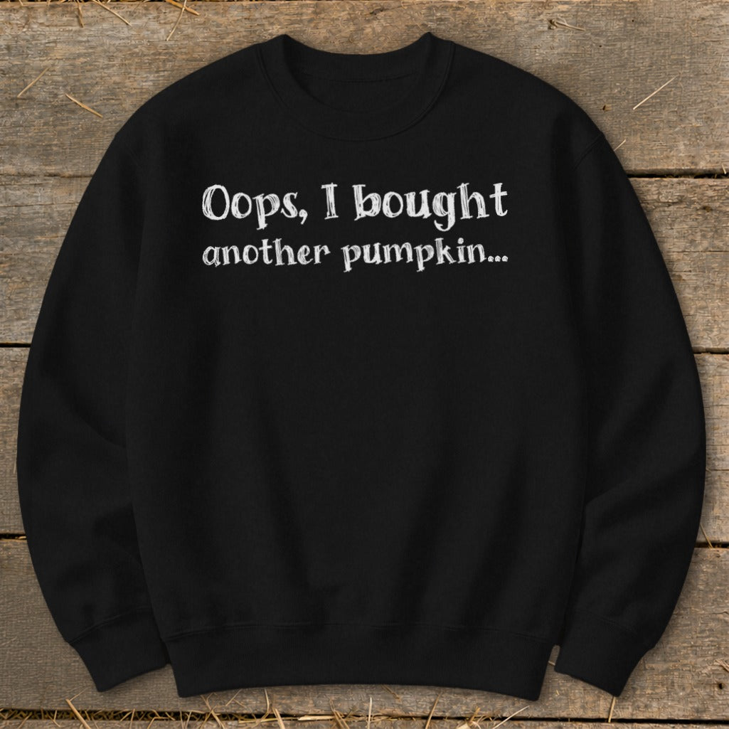 Black sweatshirt with white text reading "Oops, I bought another pumpkin..."