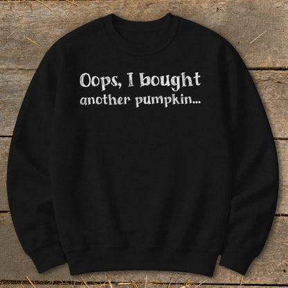 Black sweatshirt with white text reading "Oops, I bought another pumpkin..."