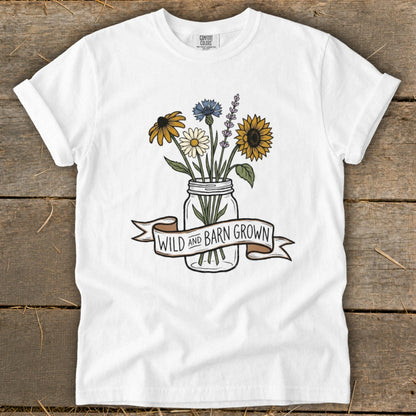 White t-shirt with a mason jar of wildflowers and "Wild and Barn Grown" banner.