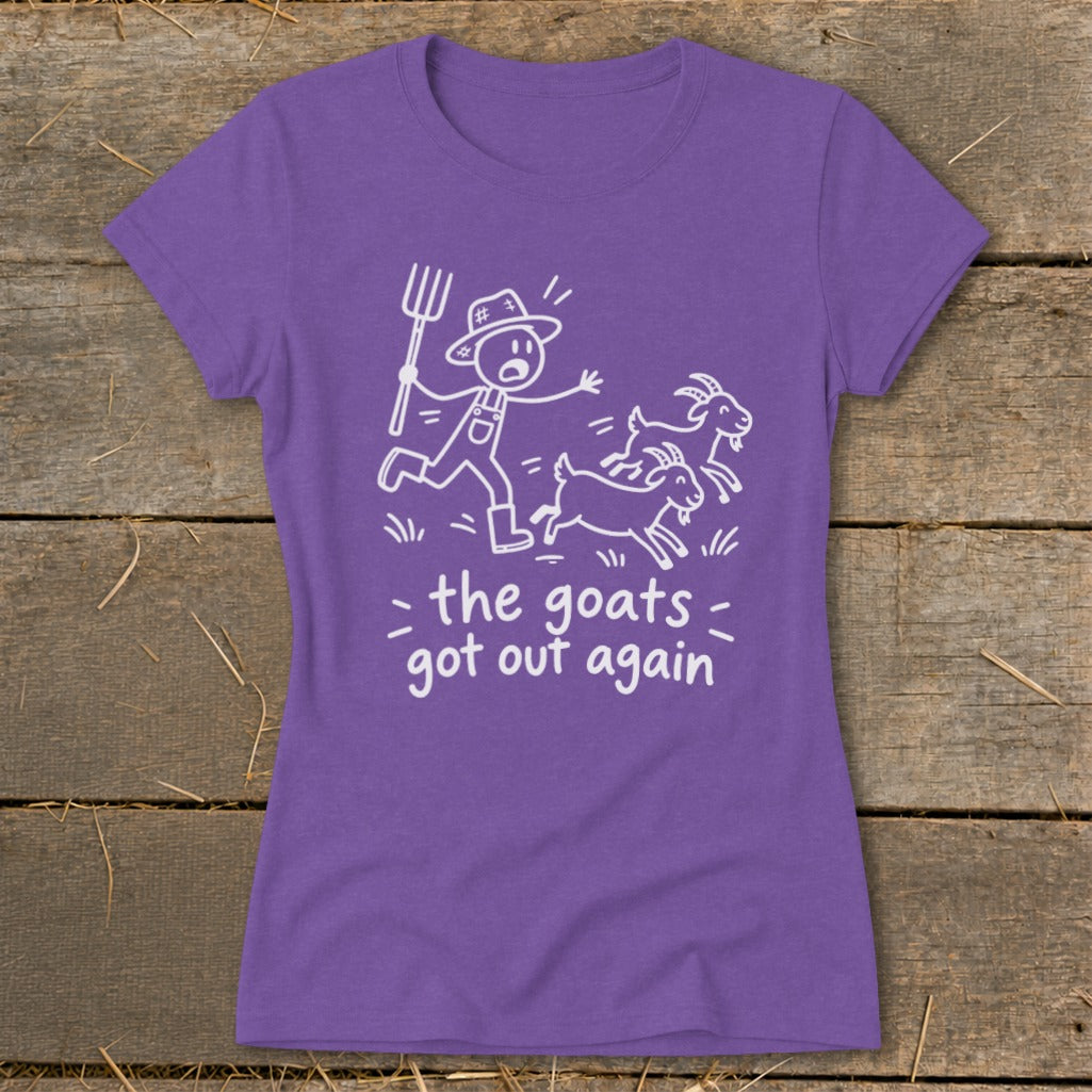 Purple t-shirt with white drawing of farmer chasing goats and text: the goats got out again.