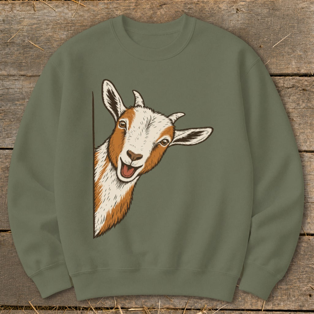 Illustration of a happy goat peeking around a corner on a green sweatshirt.