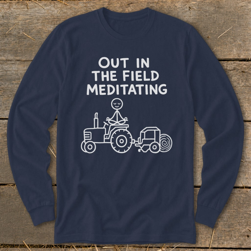 Navy long-sleeve shirt with white text and graphic of stick figure meditating on a tractor.