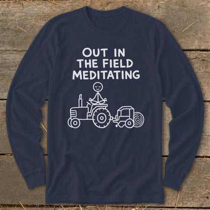Navy long-sleeve shirt with white text and graphic of stick figure meditating on a tractor.