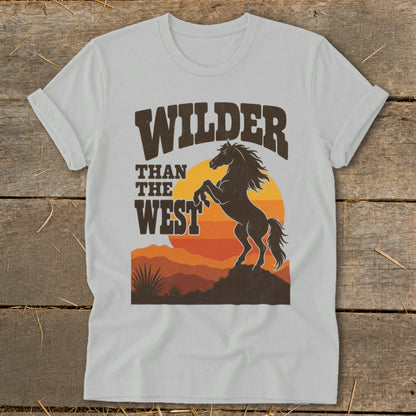 T-shirt graphic with "Wilder Than The West" text and a rearing horse silhouette.