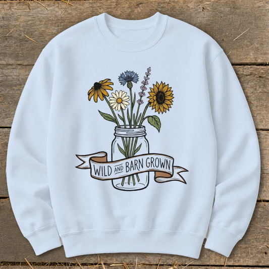 Light blue sweatshirt with mason jar bouquet and "WILD AND BARN GROWN" banner.
