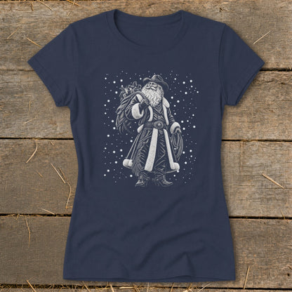Santa Claus wearing a cowboy hat and Western attire, carrying a sack of gifts.