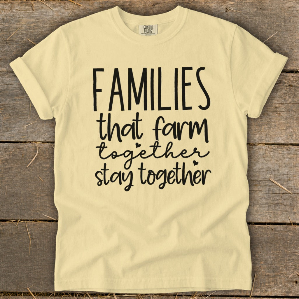Pale yellow t-shirt with "FAMILIES that farm together stay together" graphic.