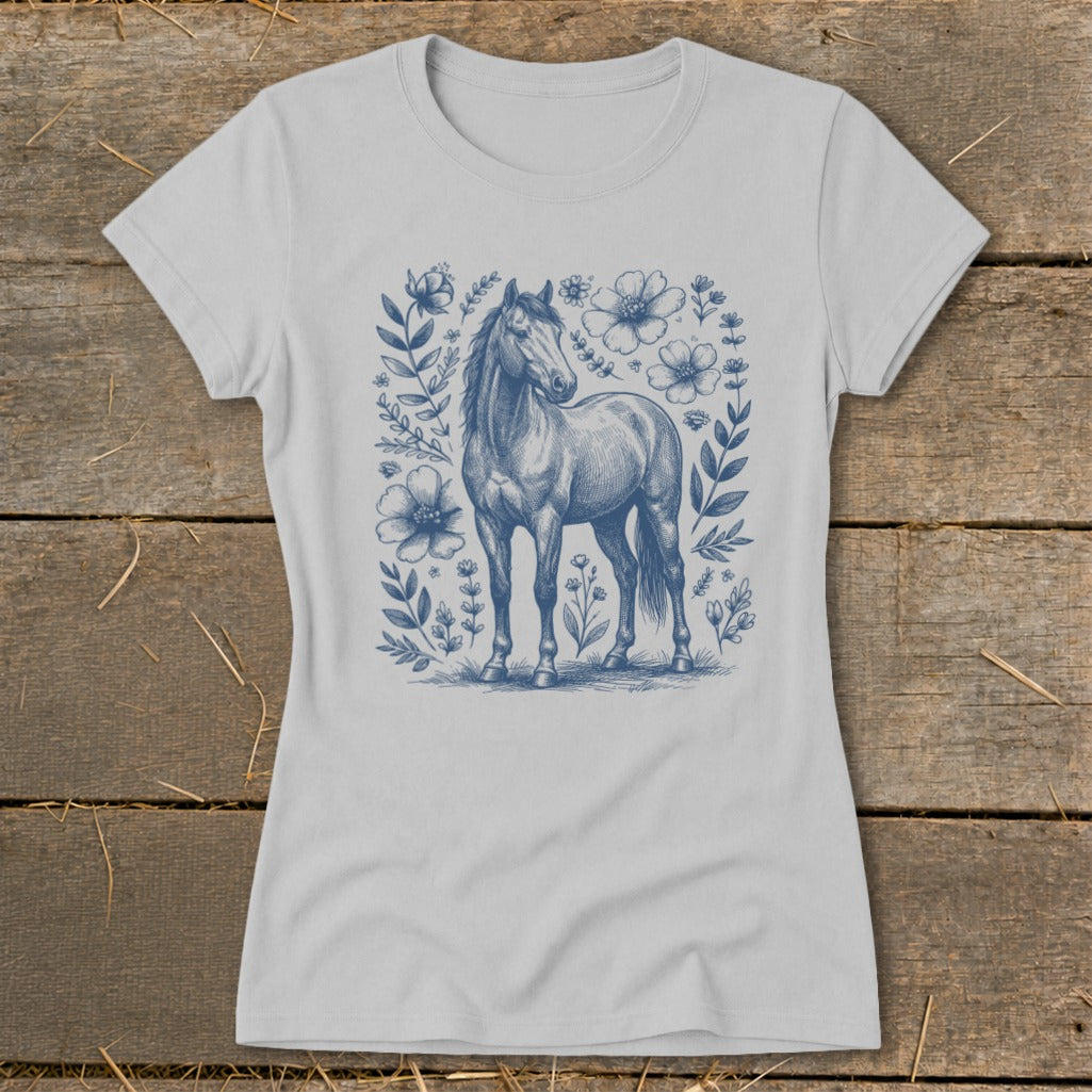 Light grey t-shirt with a blue sketch of a horse surrounded by flowers and foliage.