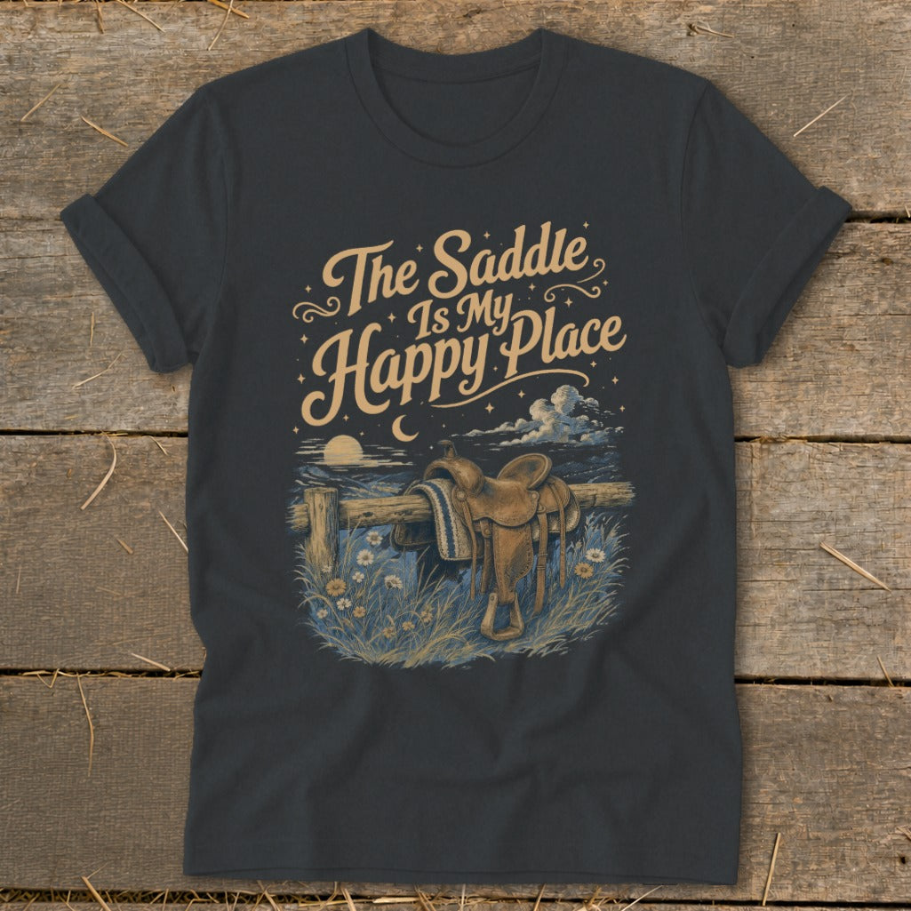 T-shirt with graphic of a saddle on a fence, text "The Saddle Is My Happy Place".