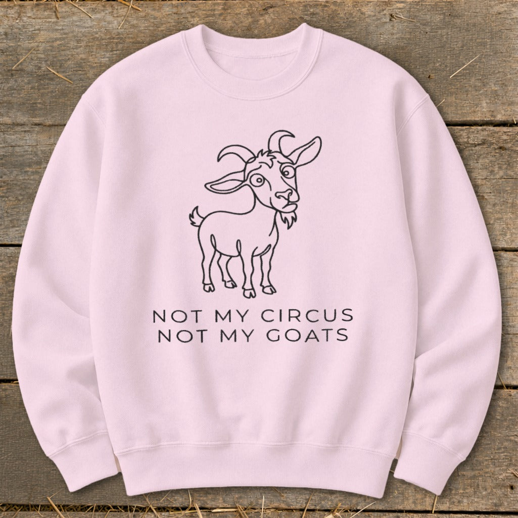 Pink sweatshirt with line drawing of a goat and text "NOT MY CIRCUS NOT MY GOATS."