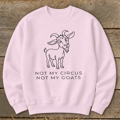 Pink sweatshirt with line drawing of a goat and text "NOT MY CIRCUS NOT MY GOATS."