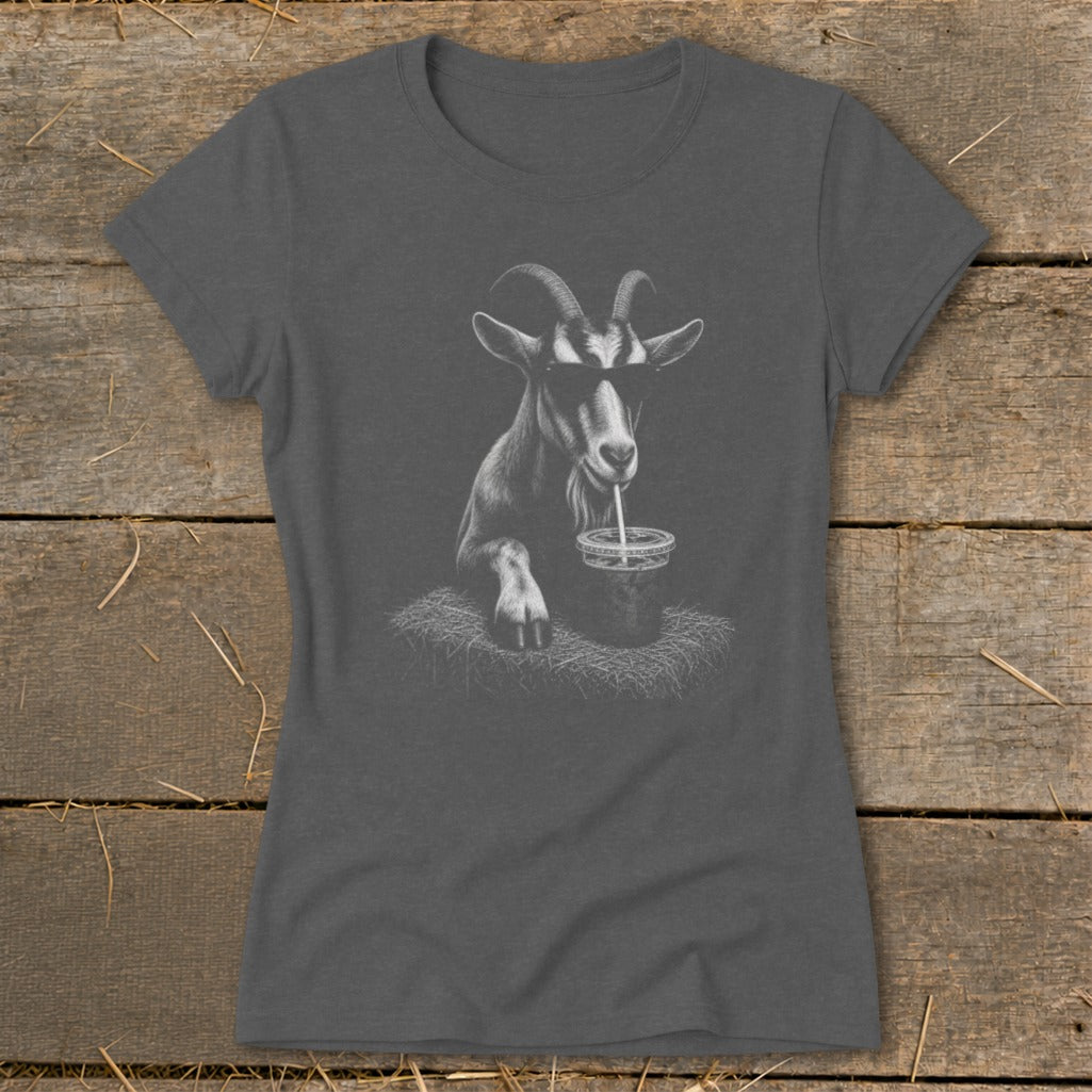Goat wearing sunglasses drinks from a cup with a straw on a t-shirt.
