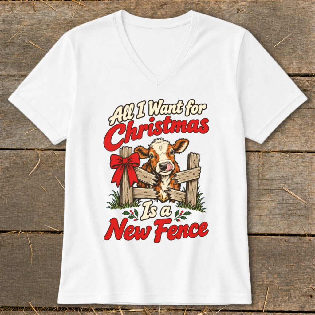 White t-shirt with cow behind fence graphic and text "All I Want for Christmas Is a New Fence".