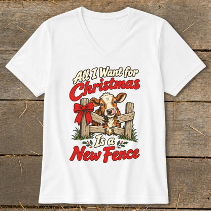 White t-shirt with cow behind fence graphic and text "All I Want for Christmas Is a New Fence".