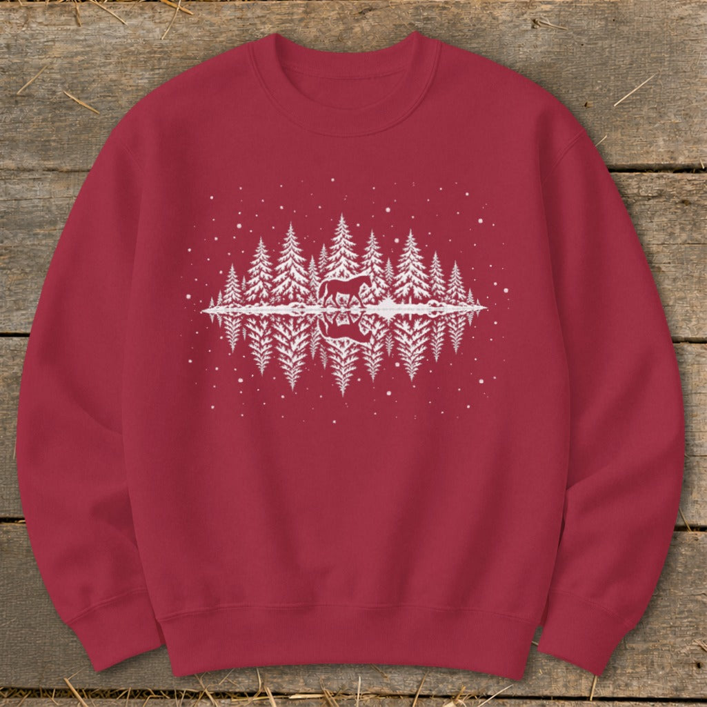 Red sweatshirt with white graphic of horse in pine forest with reflection.