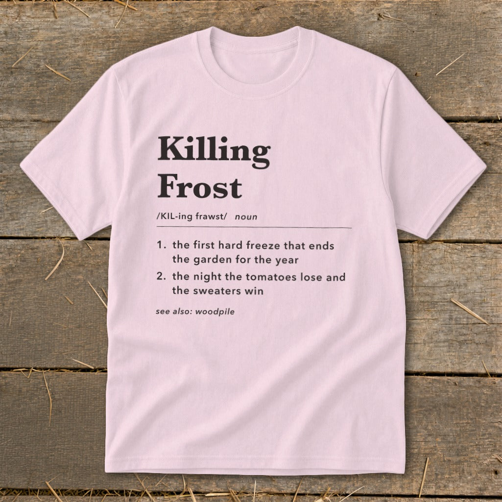 A light pink short-sleeve t-shirt with a humorous dictionary definition of killing frost printed in black.