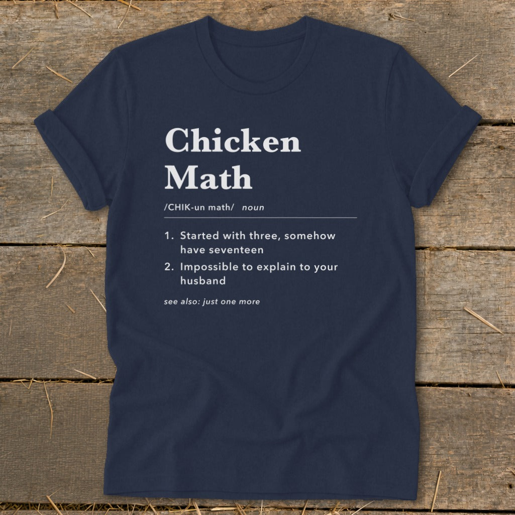 Navy t-shirt with white text defining "Chicken Math" humorously.