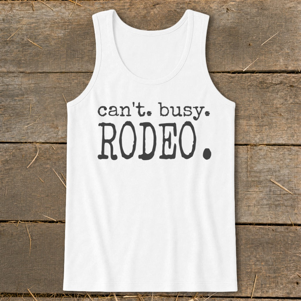 White tank top with "can't. busy. RODEO." text printed in black.