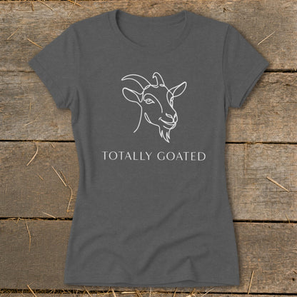 Gray t-shirt with white line drawing of a goat and text "TOTALLY GOATED".