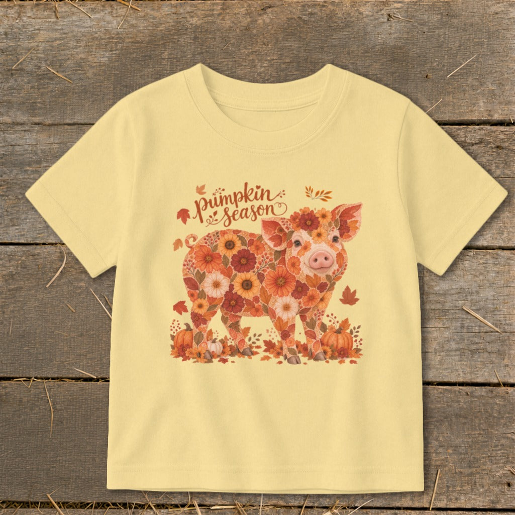 Yellow t-shirt with a floral pig graphic and "pumpkin season" text.