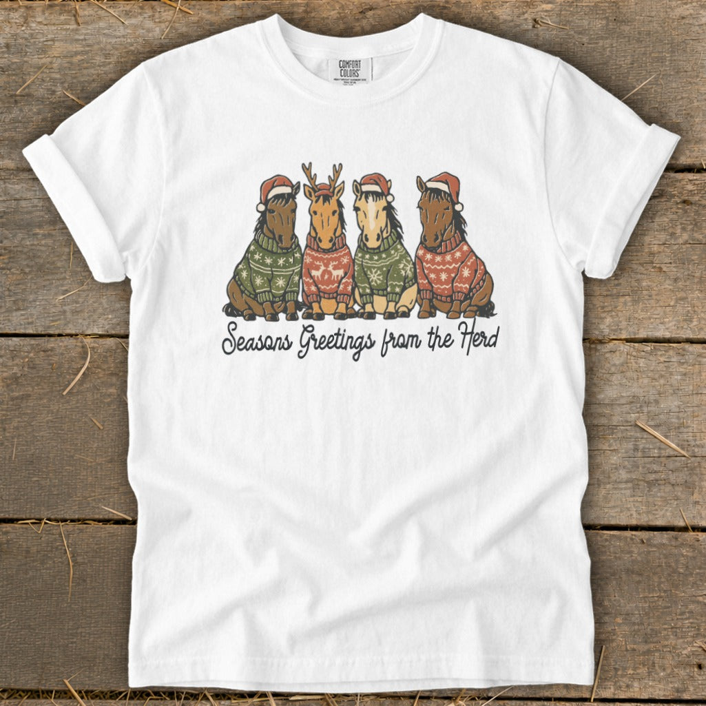 Four horses in Christmas sweaters and Santa hats, with "Seasons Greetings from the Herd" text.