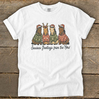 Four horses in Christmas sweaters and Santa hats, with "Seasons Greetings from the Herd" text.