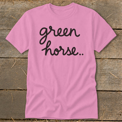 Pink t-shirt with "green horse.." in black cursive font.