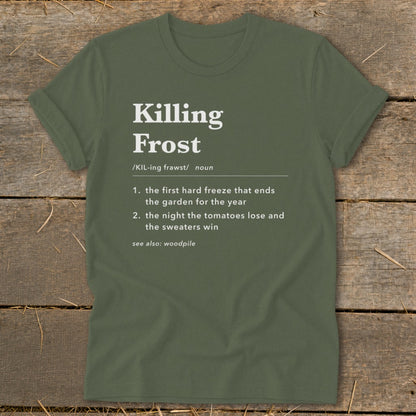 An olive green t-shirt featuring dictionary-style text defining Killing Frost on a wooden background.