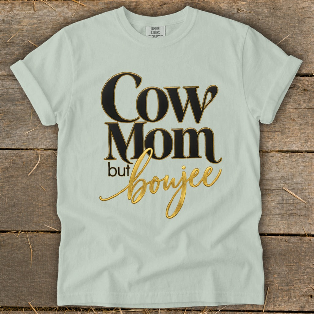 Light green t-shirt with black and gold text reading "Cow Mom but boujee".