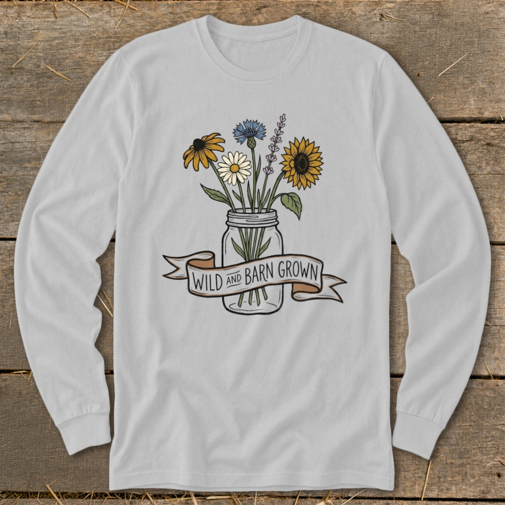 Long sleeve shirt with a mason jar full of flowers and a banner reading "Wild and Barn Grown."