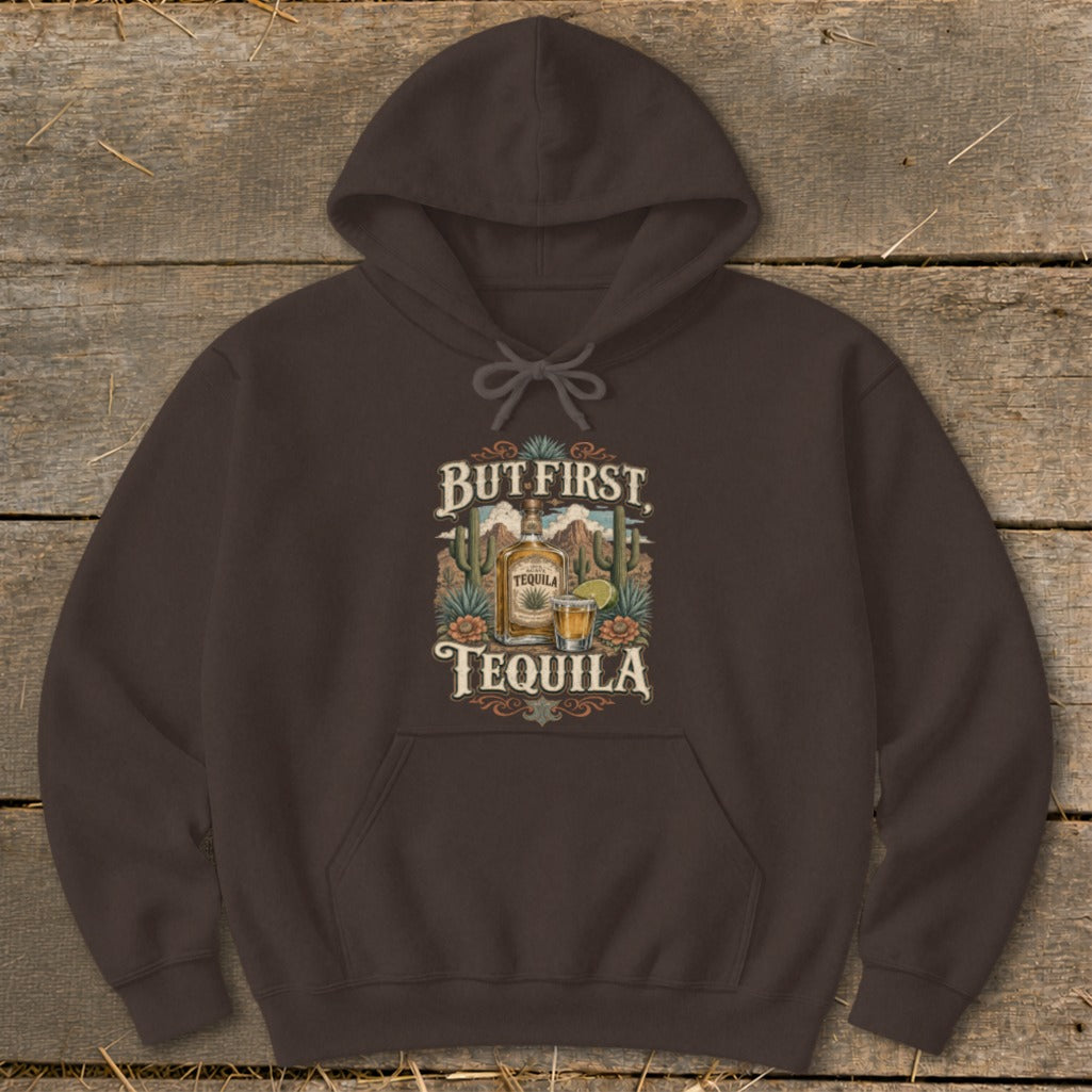 Brown hoodie with "But First, Tequila" graphic featuring a tequila bottle, shot, and desert landscape.