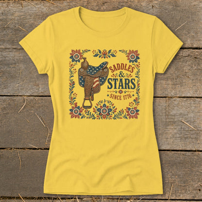 Yellow t-shirt with a Western saddle and text "Saddles & Stars Since 1776".