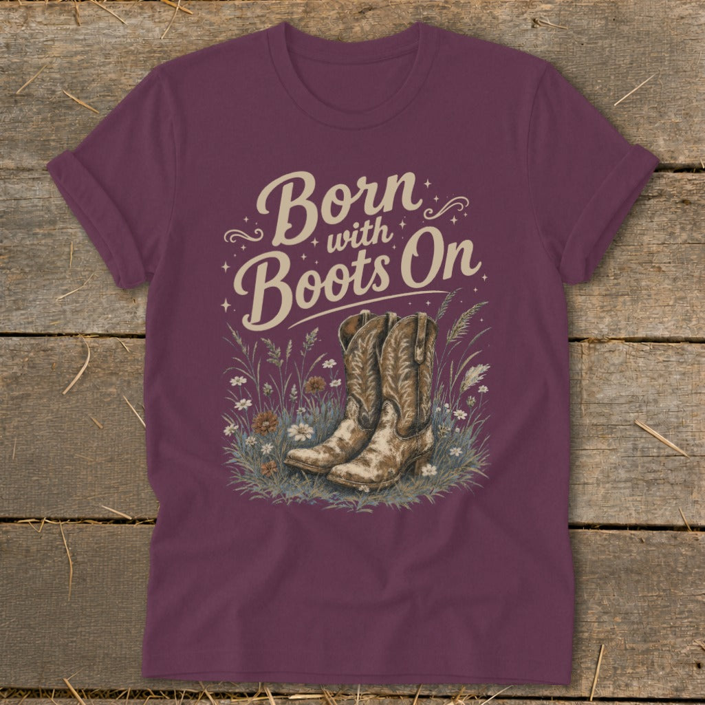 Maroon t-shirt with "Born with Boots On" text and cowboy boots illustration.