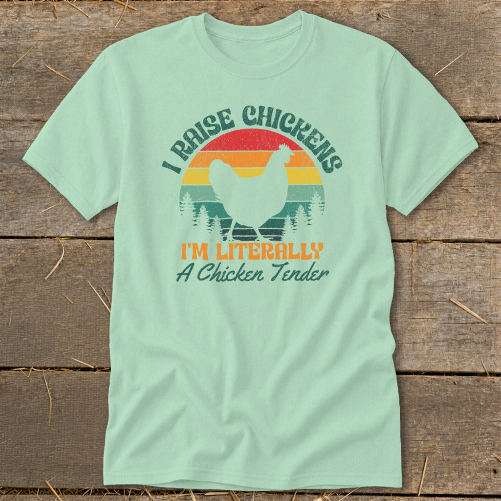 Light mint t-shirt with "I raise chickens I'm literally a chicken tender" text and chicken graphic.