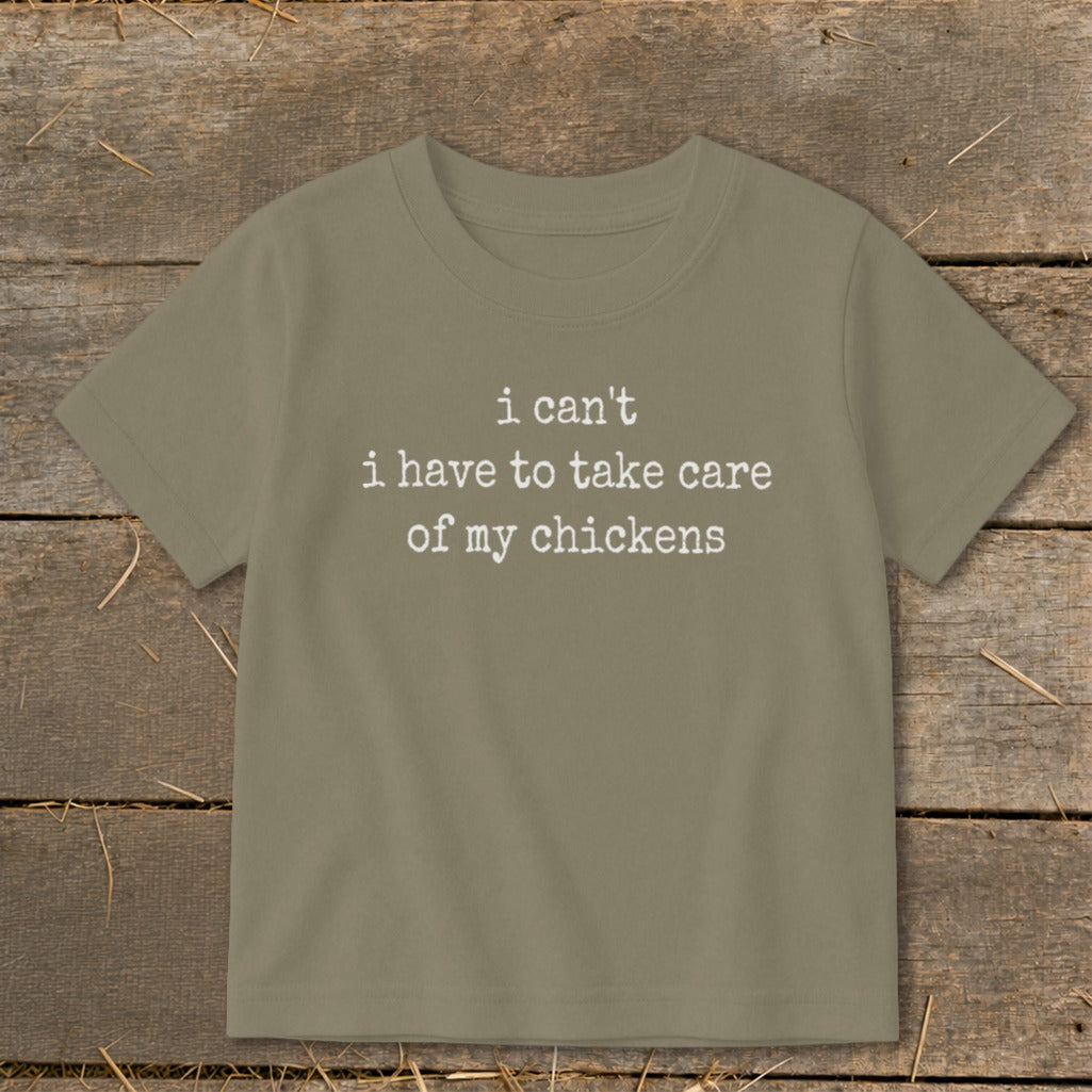 Olive t-shirt with white text "i can't i have to take care of my chickens".