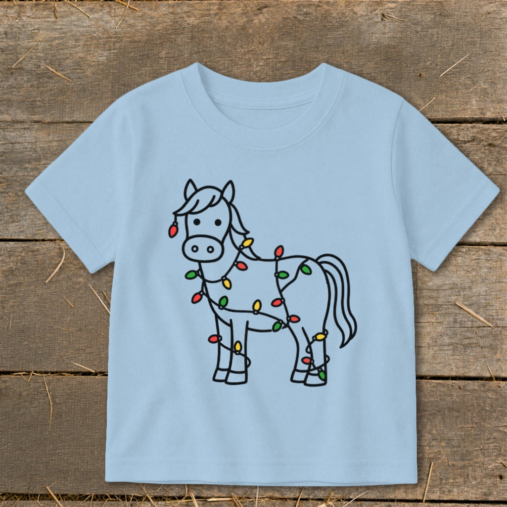 Light blue t-shirt with a cartoon horse wrapped in colorful Christmas lights.