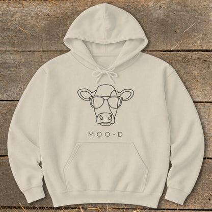 Light cream hoodie with a black line drawing of a cow wearing glasses and the text "MOO-D".