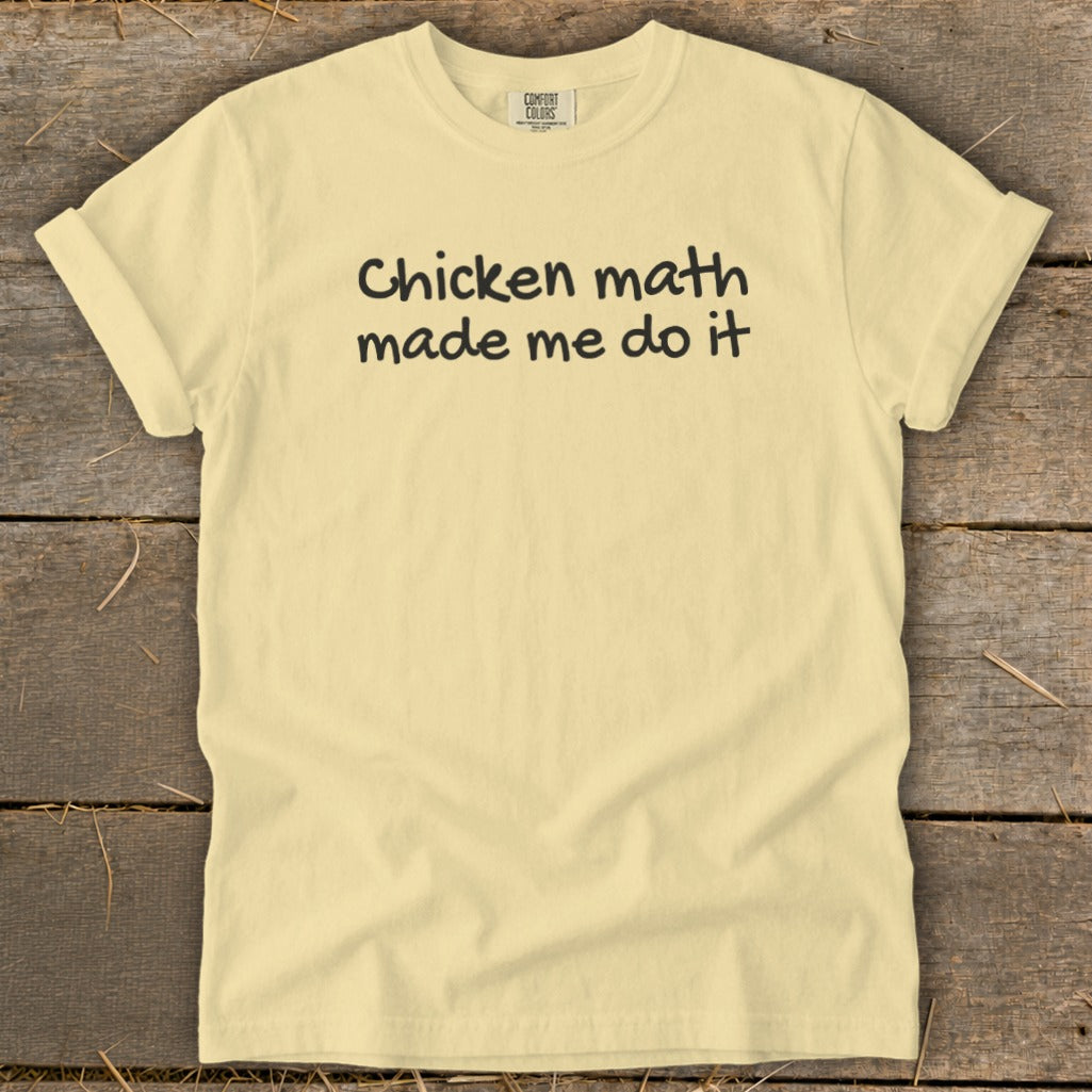 Pale yellow t-shirt with black text that reads "Chicken math made me do it".