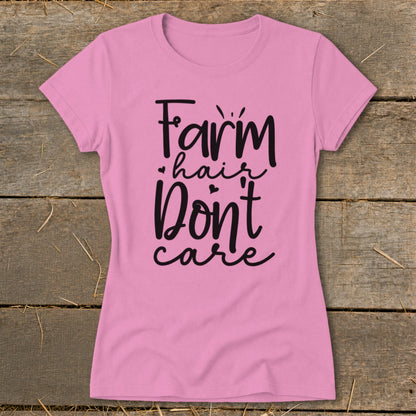 Pink t-shirt with black text "Farm hair Don't care".