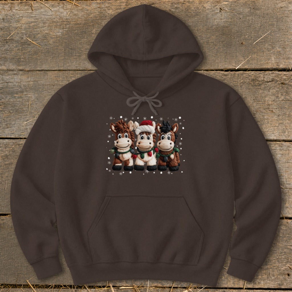 Brown hoodie with three cartoon horses wearing festive scarves and a Santa hat.
