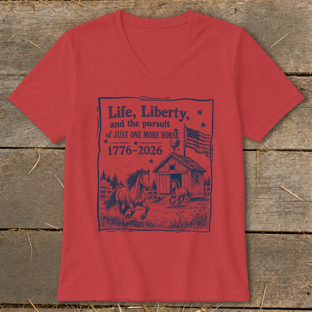 Red v-neck t-shirt with navy graphic: "Life, Liberty, and the pursuit of JUST ONE MORE HORSE 1776-2026"