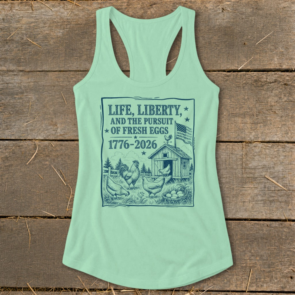 Light green tank top with "Life, Liberty, and the Pursuit of Fresh Eggs" graphic.