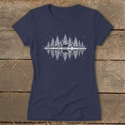 Navy t-shirt with white silhouette of pine trees reflected in water with a deer.