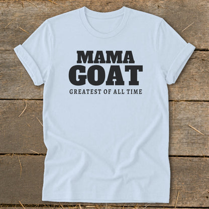 White t-shirt with black text that reads "MAMA GOAT GREATEST OF ALL TIME".