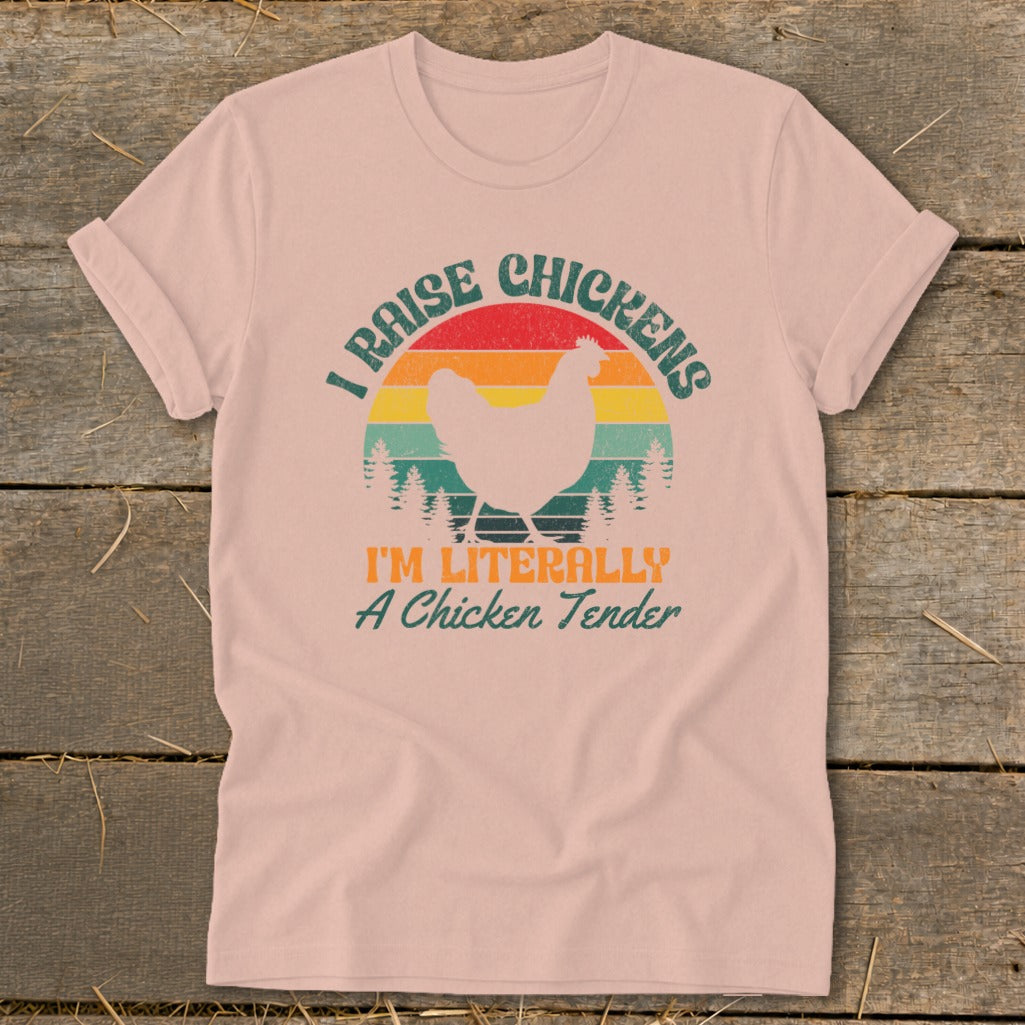 Pink t-shirt with vintage sunset graphic and text "I RAISE CHICKENS I'M LITERALLY A Chicken Tender".