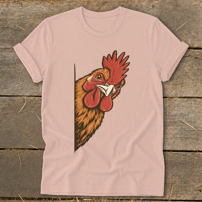 Rooster peeking from the side of a pink t-shirt.