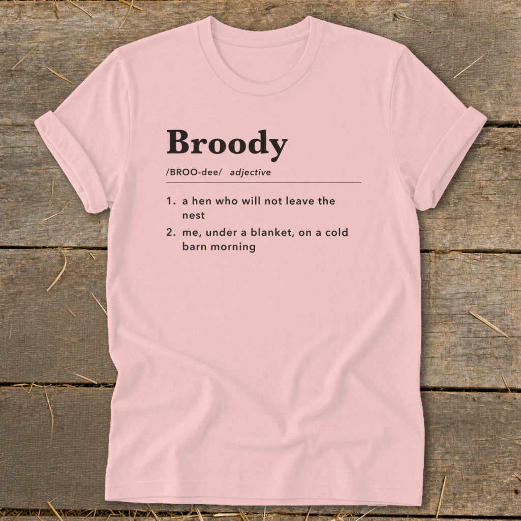 Pink t-shirt with "Broody" definition: hen not leaving nest and you under blanket.