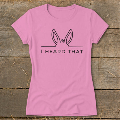 Pink t-shirt with black graphic of donkey ears and the text "I HEARD THAT."